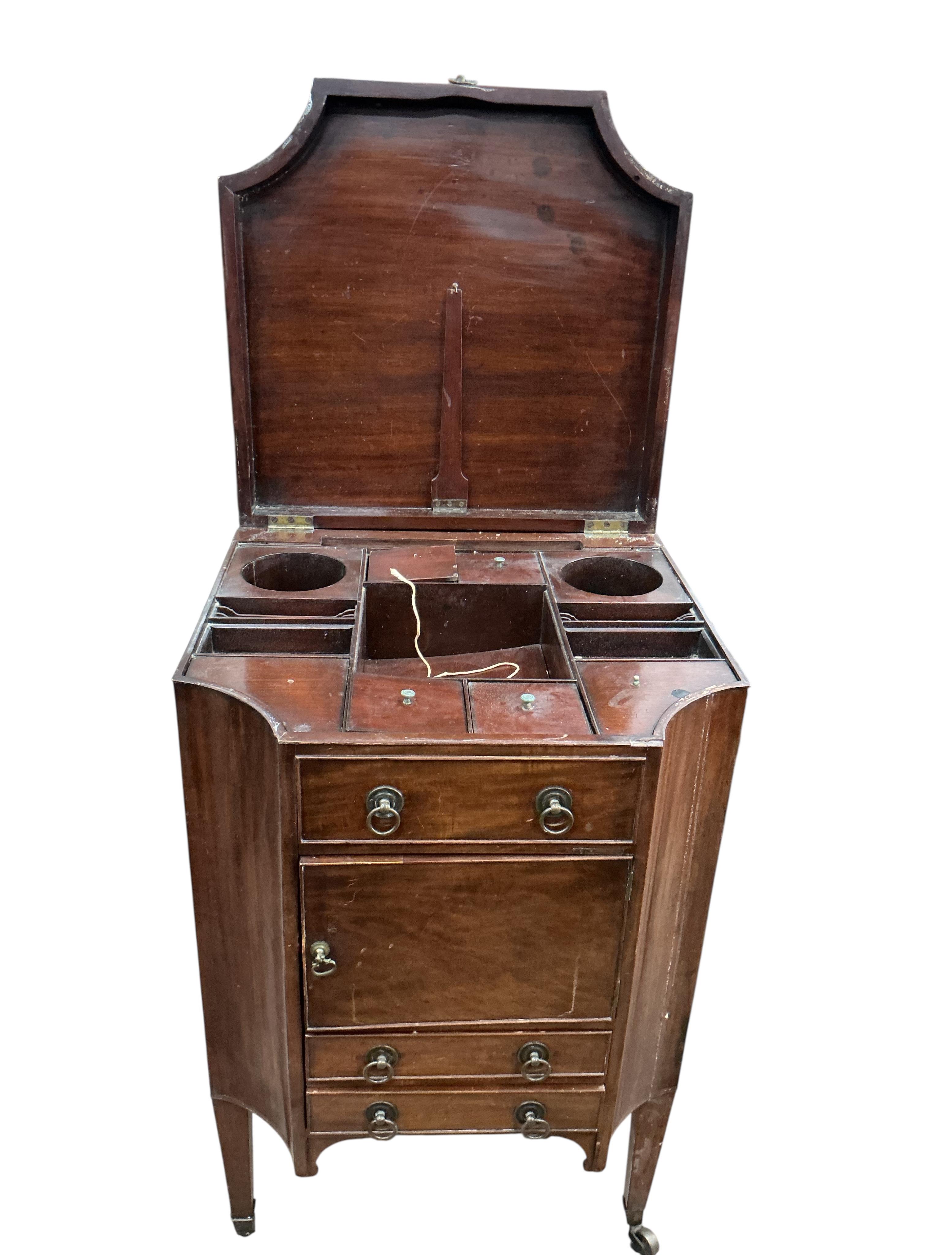 A George III mahogany enclosed washstand, damaged, width 58cm, height 92cm